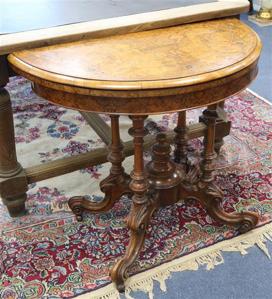 A Victorian walnut demi lune card table W.93cm